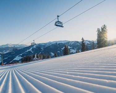 groomed-slopes-snowspace-salzburg-winter-landscape-chairlift
