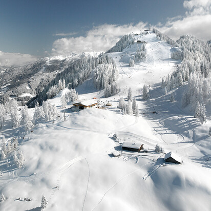 Alpendorf im Skigebiet Snow Space Salzburg | © Alpendorf Bergbahnen AG Blick auf das Alpendorf St. Johann im Skigebiet Snow Space Salzburg von Oben | © Alpendorf Bergbahnen AG