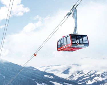 View of G-LINK, the world’s biggest aerial tramway, towards the snow-covered valleys of Wagrain at Snow Space Salzburg